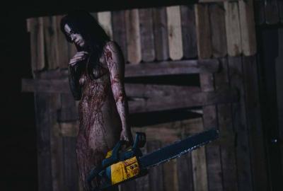 Naked Zombie Girl with a chainsaw