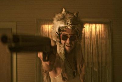 My Father Die film still man with wolf hat points shotgun