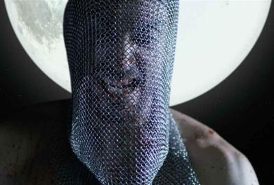 Carne Fresca film still metal mesh masked man