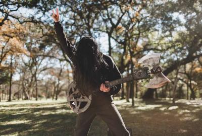 Death Metal film still rocker plays guitar in the park