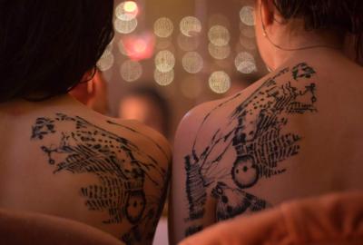 Double Date tattooed backs