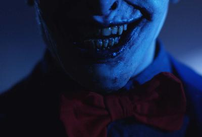 Bedeviled film still smiling creepy creature man