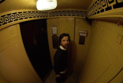 Hellevate film still man in elevator