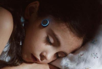 KEPT film still little girl with head probes sleeping