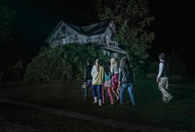 Lost After Dark A group of young people walking towards a scary house