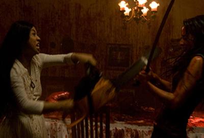 Macabre two bloodied women fight