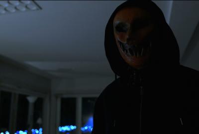 No Caller I.D. film still masked man with a hoodie