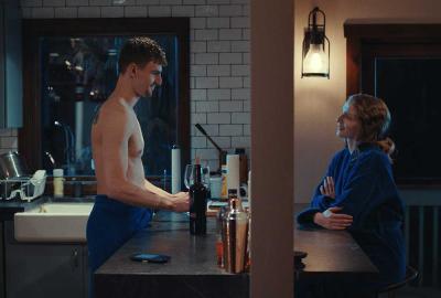 Axe to the Face film still shirtless man talking to a woman