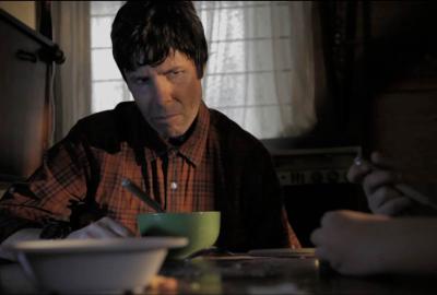 La Piedad creepy father looks at his daughter as she eats cereal