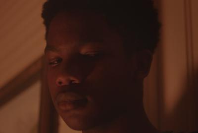 Wolves film still of a young black man's face