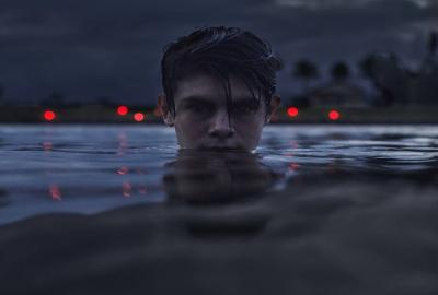 Sweet River film still young man in the water