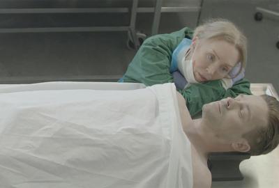 Sybil film still morgue worker looks adoringly at the cadaver.