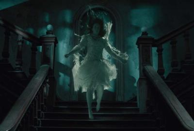 THE LODGERS film still female ghost floats down stairs