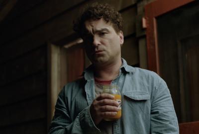 The Master Cleanse film still man holding a smoothie drink in a glass.