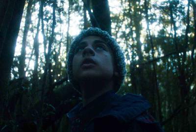 Hombre film still boy in the woods looks scared