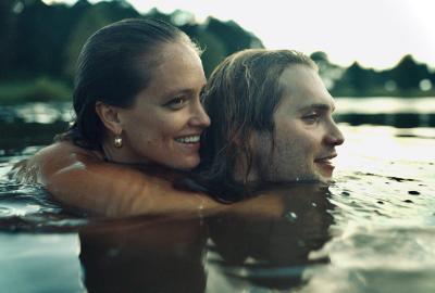 Wicked Games film still couple holding each other in a lake