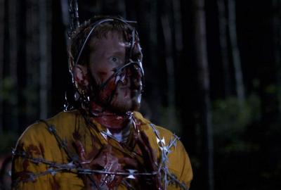 Wrong Turn 3: Left For Dead bloodied man chained up