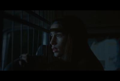 A young girl hides